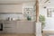 Kitchen open to a living room with restored wooden columns,