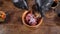 Kitchen in restaurant, food video, slow motion. Close-up shot of male chef in black gloves preparing gourmet dish of