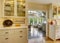 Kitchen room with exit to patio area in sunroom