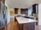 Kitchen room interior with deep brown cabinets with granite counter top