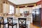 Kitchen room interior. View of counter top with black chairs