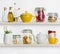 Kitchen shelves with various food ingredients and utensils on white