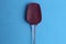 Kitchen silicone spatula spoon on blue background