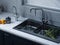 A kitchen sink detail shot with grey cabine. ai generative