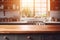Kitchen space with kitchen utensils in blur and wooden table in foreground. Essence of warm and functional kitchen