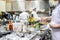 Kitchen staff busy with preparing food in fancy restaurant