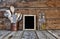 Kitchen still life. Kitchen utensils in a stand near the wooden wall.Kitchen tools, wooden frame with free space for text on a kit