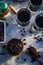 Kitchen still life with whole coffee beans, ground coffee, coffee grinder, glass mugs filled with black coffee,