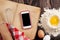 Kitchen table with ingredients, utensils and phone