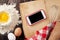 Kitchen table with ingredients, utensils and phone