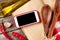 Kitchen table with ingredients, utensils and phone