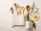 On the kitchen table kitchen utensils on a kitchen towel on a white background