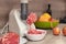 Kitchen table with a meat grinder,  homemade minced meat, home kitchen interior. Selective focus