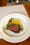 Kitchen technology. Dish presentation. Roast Beef served on plate