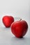 Kitchen things-FOOD AppleTwo ripe bright red with brown dots apples grade Champion  on white background  frostMumbai India