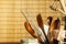 Kitchen tools on the table. Utensils for chefs. Old wooden spoon.