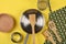 Kitchen utensil on yellow background, top view
