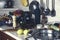 Kitchen utensils, bottles, vegetables and condiments on the kitchen table