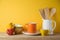 Kitchen utensils and dishware on wooden shelf. Autumn kitchen interior background