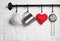 Kitchen utensils, felt heart on rank