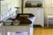 Kitchen utensils in the interior of old traditional rural wooden house.