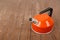 Kitchen utensils -Orange whistling kettle wooden