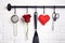 Kitchen utensils, red rose and felt heart on rank