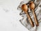 Kitchen utensils on white table with yellow kitchen towel