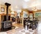 Kitchen with wood burning fireplace, and patterned tile floor.