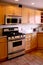 Kitchen wood cabinets stainless stove