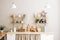 Kitchen with wooden dishes and kitchen accessories on the table and shelves