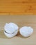 Kitchenware, 3 white ceramic bowls of apple shape design on wood dining table background