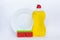 Kitchenware washing yellow liquid, clean bottle, clean plate and