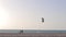 Kite-boarder jumps on the beach