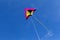 Kite in the bright blue sky.