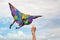 kite in hand against the blue sky in summer, flying kite launching, fun summer