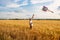 Kite in hand against the blue sky in summer, flying kite launching, fun summer vacation, under the field, freedom