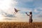 Kite in hand against the blue sky in summer, flying kite launching, fun summer vacation, under the field, freedom