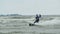 Kite surfer rides on a wave  slow motion