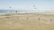 Kite surfers in action on the beautiful sandy beach Playa de Sotavento in Fuerteventura, Canary Islands, Spain