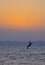 Kite surfing at sunset