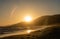 Kite surfing at sunset at Zuma beach, Malibu, California