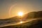 Kite surfing at sunset at Zuma beach, Malibu, California