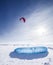 Kiteboarder with blue kite