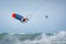 Kiteboarder kitesurfer man athlete jumping, kitesurfing kiteboarding jump