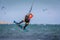 Kiteboarder kitesurfer man athlete jumping, kitesurfing kiteboarding jump