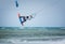 Kiteboarder kitesurfer man athlete jumping, kitesurfing kiteboarding jump