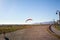 A kiteboarder practices with his red sail at Ambleside Beach, West Vancouver