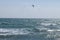 Kiteboarder is pulled across water by a power kite in Cyprus, Europe near famous Pissouri beach. Wonderful day with water activity