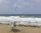 Kiteboarding along empty ocean beach